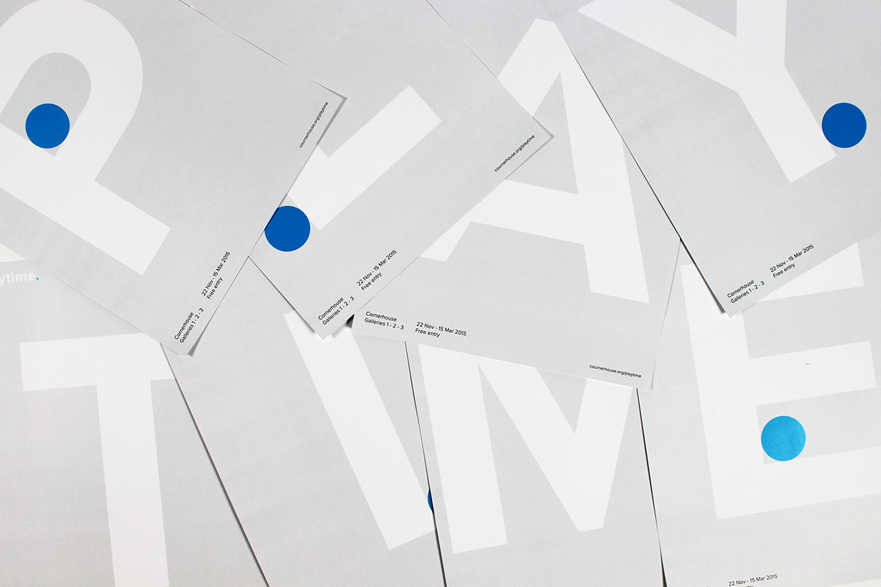 White letters on transparent sheets scattered on a surface.