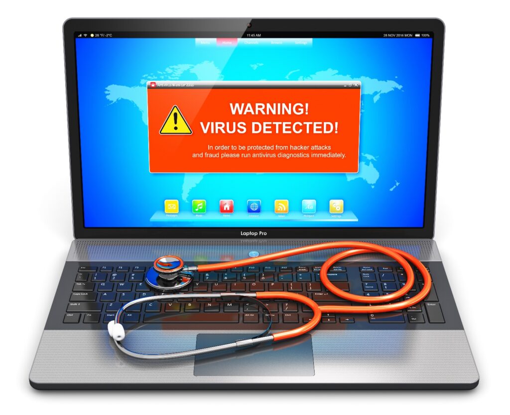 Laptop with virus warning and a stethoscope on keyboard.